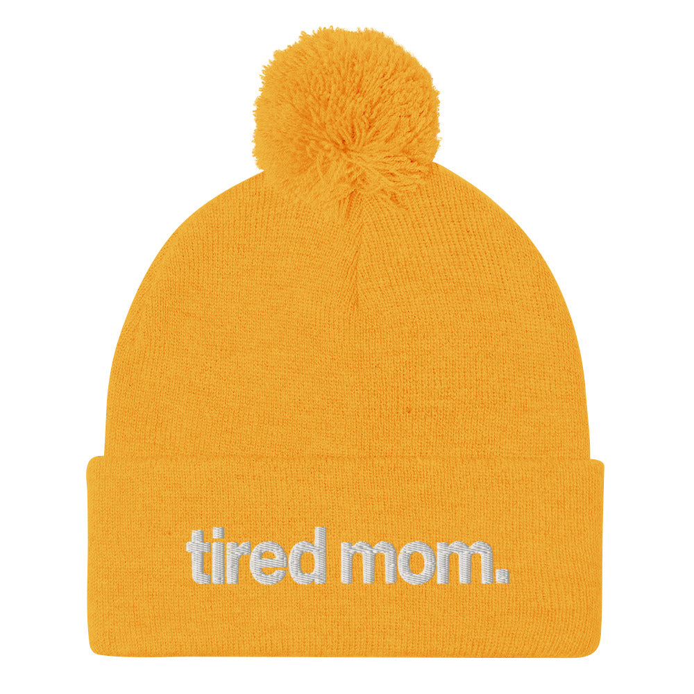tired mom. pom-pom beanie