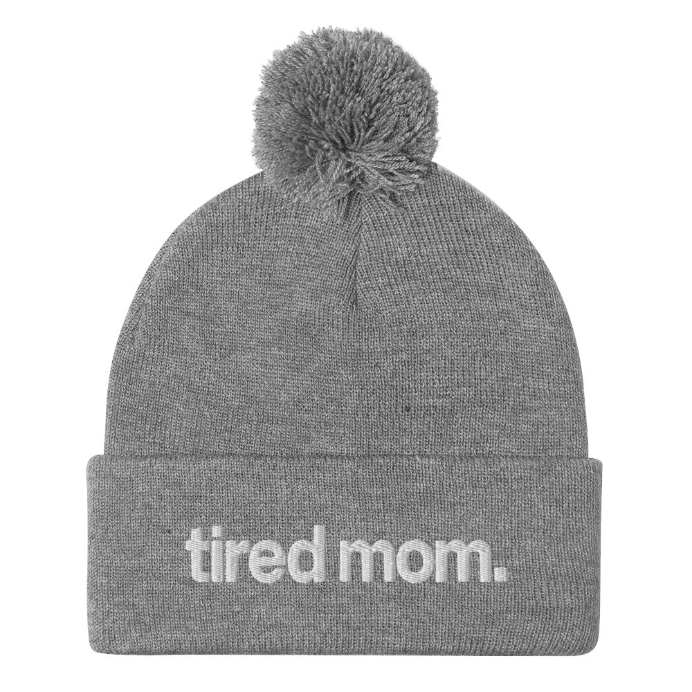 tired mom. pom-pom beanie