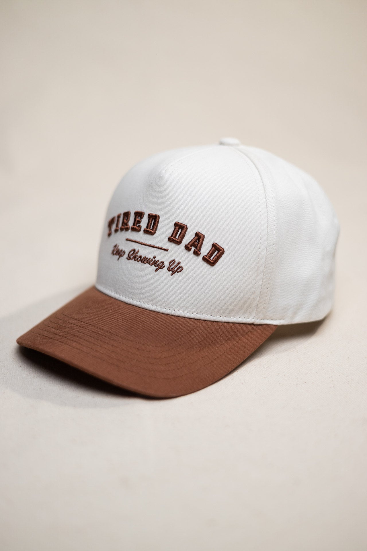 Tired Dad // Keep Showing Up // White & Brown Snapback